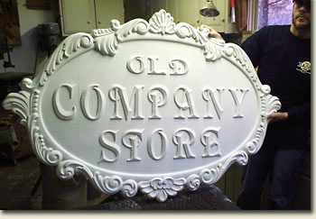 image of woodcarved mold of company store sign