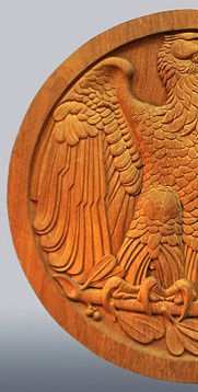 image of left side of medallion eagle carved in wood