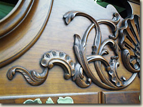 image showing woodcarved detail on front of top of highboy