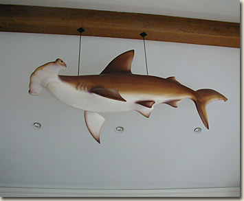 image of handcarved and airbrushed hammerhead shark